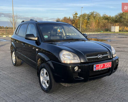 Черный Хендай Туксон, объемом двигателя 1.98 л и пробегом 243 тыс. км за 8500 $, фото 3 на Automoto.ua