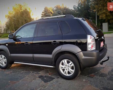 Черный Хендай Туксон, объемом двигателя 2 л и пробегом 230 тыс. км за 8600 $, фото 104 на Automoto.ua