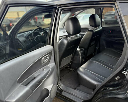 Черный Хендай Туксон, объемом двигателя 1.98 л и пробегом 230 тыс. км за 7750 $, фото 6 на Automoto.ua