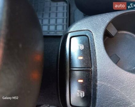 Черный Хендай Туксон, объемом двигателя 2 л и пробегом 219 тыс. км за 8500 $, фото 4 на Automoto.ua