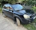 Черный Хендай Туксон, объемом двигателя 2 л и пробегом 330 тыс. км за 4574 $, фото 1 на Automoto.ua