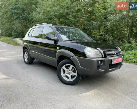 Черный Хендай Туксон, объемом двигателя 2 л и пробегом 174 тыс. км за 7600 $, фото 1 на Automoto.ua
