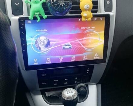 Черный Хендай Туксон, объемом двигателя 1.98 л и пробегом 238 тыс. км за 8400 $, фото 6 на Automoto.ua