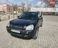 Черный Хендай Туксон, объемом двигателя 1.98 л и пробегом 339 тыс. км за 7500 $, фото 1 на Automoto.ua