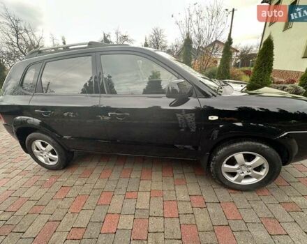 Черный Хендай Туксон, объемом двигателя 2 л и пробегом 218 тыс. км за 7600 $, фото 4 на Automoto.ua