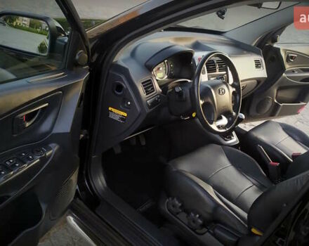 Черный Хендай Туксон, объемом двигателя 2 л и пробегом 230 тыс. км за 8600 $, фото 199 на Automoto.ua