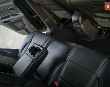 Черный Хендай Туксон, объемом двигателя 2 л и пробегом 230 тыс. км за 8600 $, фото 184 на Automoto.ua