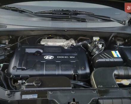 Черный Хендай Туксон, объемом двигателя 2 л и пробегом 230 тыс. км за 8600 $, фото 205 на Automoto.ua