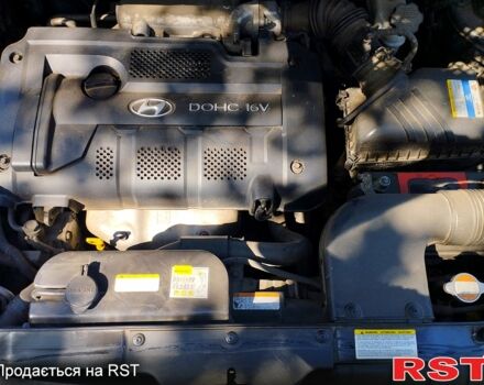 Черный Хендай Туксон, объемом двигателя 2 л и пробегом 230 тыс. км за 8000 $, фото 3 на Automoto.ua