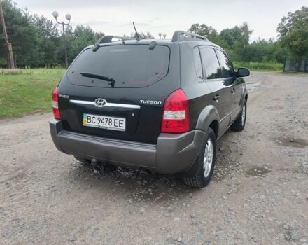 Черный Хендай Туксон, объемом двигателя 2 л и пробегом 160 тыс. км за 7600 $, фото 4 на Automoto.ua