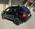 Черный Хендай Туксон, объемом двигателя 2 л и пробегом 189 тыс. км за 8250 $, фото 21 на Automoto.ua