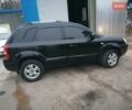 Черный Хендай Туксон, объемом двигателя 1.98 л и пробегом 238 тыс. км за 8400 $, фото 4 на Automoto.ua