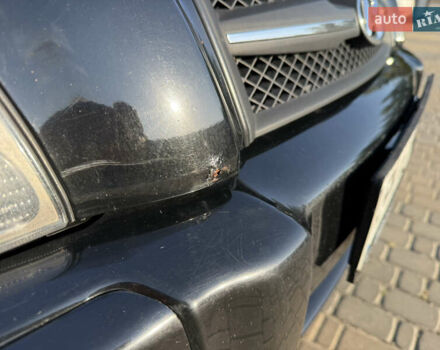 Черный Хендай Туксон, объемом двигателя 2 л и пробегом 270 тыс. км за 8200 $, фото 14 на Automoto.ua