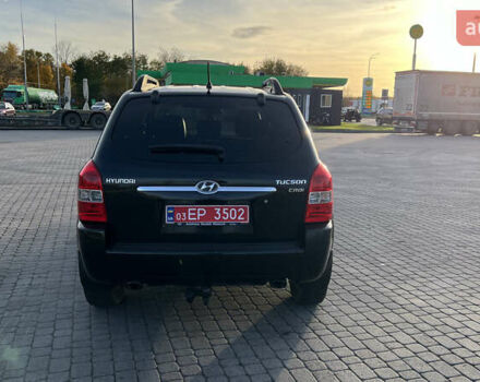 Черный Хендай Туксон, объемом двигателя 1.98 л и пробегом 243 тыс. км за 8500 $, фото 5 на Automoto.ua