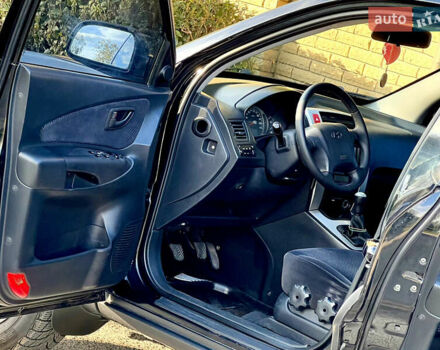 Черный Хендай Туксон, объемом двигателя 2 л и пробегом 167 тыс. км за 7800 $, фото 6 на Automoto.ua