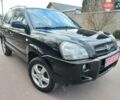 Черный Хендай Туксон, объемом двигателя 2 л и пробегом 246 тыс. км за 8550 $, фото 1 на Automoto.ua