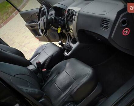 Чорний Хендай Туксон, об'ємом двигуна 2 л та пробігом 229 тис. км за 8600 $, фото 111 на Automoto.ua