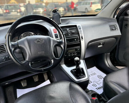 Черный Хендай Туксон, объемом двигателя 1.98 л и пробегом 230 тыс. км за 7750 $, фото 9 на Automoto.ua