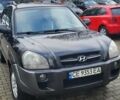 Черный Хендай Туксон, объемом двигателя 2 л и пробегом 230 тыс. км за 7700 $, фото 1 на Automoto.ua