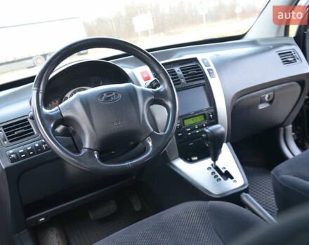 Черный Хендай Туксон, объемом двигателя 2 л и пробегом 183 тыс. км за 9150 $, фото 45 на Automoto.ua