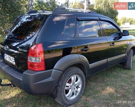 Черный Хендай Туксон, объемом двигателя 1.98 л и пробегом 201 тыс. км за 8800 $, фото 6 на Automoto.ua