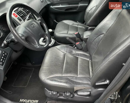 Черный Хендай Туксон, объемом двигателя 2 л и пробегом 180 тыс. км за 7700 $, фото 21 на Automoto.ua