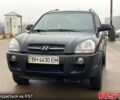 Чорний Хендай Туксон, об'ємом двигуна 2 л та пробігом 154 тис. км за 7400 $, фото 1 на Automoto.ua