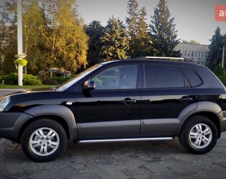 Черный Хендай Туксон, объемом двигателя 2 л и пробегом 230 тыс. км за 8600 $, фото 4 на Automoto.ua