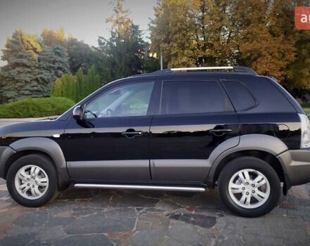 Черный Хендай Туксон, объемом двигателя 2 л и пробегом 230 тыс. км за 8600 $, фото 101 на Automoto.ua