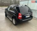 Черный Хендай Туксон, объемом двигателя 2 л и пробегом 301 тыс. км за 4500 $, фото 2 на Automoto.ua