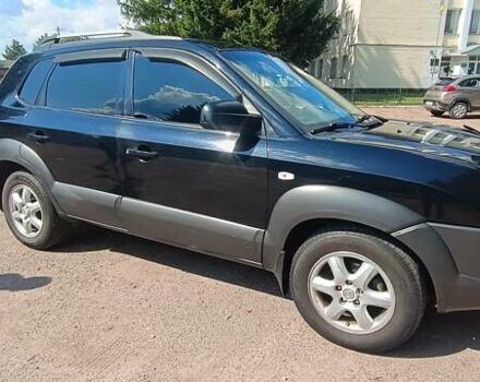 Чорний Хендай Туксон, об'ємом двигуна 2 л та пробігом 261 тис. км за 7500 $, фото 2 на Automoto.ua