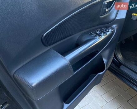 Черный Хендай Туксон, объемом двигателя 1.98 л и пробегом 286 тыс. км за 7300 $, фото 24 на Automoto.ua