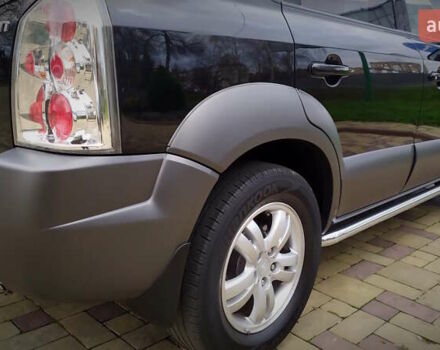 Чорний Хендай Туксон, об'ємом двигуна 2 л та пробігом 229 тис. км за 8600 $, фото 70 на Automoto.ua