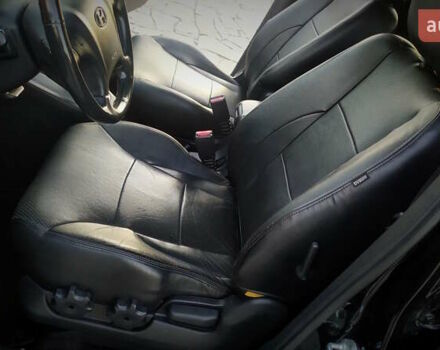 Черный Хендай Туксон, объемом двигателя 2 л и пробегом 230 тыс. км за 8600 $, фото 144 на Automoto.ua