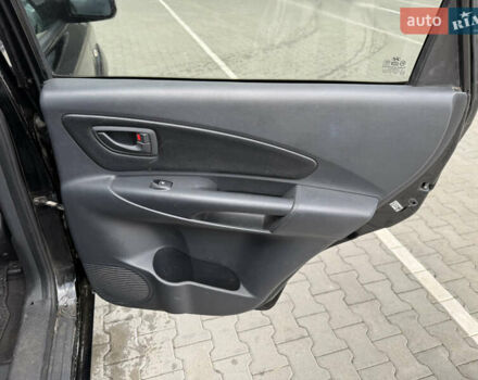 Черный Хендай Туксон, объемом двигателя 2 л и пробегом 182 тыс. км за 6999 $, фото 14 на Automoto.ua