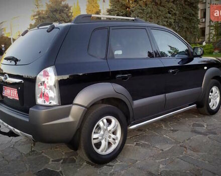 Черный Хендай Туксон, объемом двигателя 2 л и пробегом 230 тыс. км за 8600 $, фото 120 на Automoto.ua