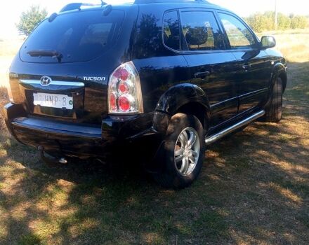 Черный Хендай Туксон, объемом двигателя 2 л и пробегом 236 тыс. км за 8300 $, фото 3 на Automoto.ua