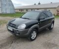 Черный Хендай Туксон, объемом двигателя 2 л и пробегом 160 тыс. км за 7600 $, фото 1 на Automoto.ua