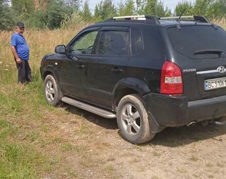 Черный Хендай Туксон, объемом двигателя 1.98 л и пробегом 222 тыс. км за 8200 $, фото 2 на Automoto.ua