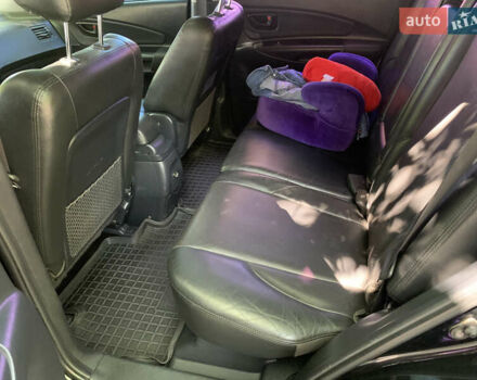 Черный Хендай Туксон, объемом двигателя 1.98 л и пробегом 232 тыс. км за 9100 $, фото 12 на Automoto.ua