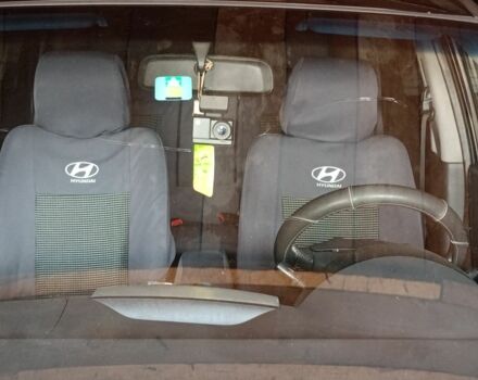 Черный Хендай Туксон, объемом двигателя 2 л и пробегом 240 тыс. км за 8800 $, фото 4 на Automoto.ua