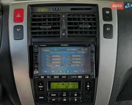 Черный Хендай Туксон, объемом двигателя 2 л и пробегом 310 тыс. км за 6499 $, фото 15 на Automoto.ua