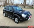 Черный Хендай Туксон, объемом двигателя 20 л и пробегом 171 тыс. км за 7950 $, фото 1 на Automoto.ua