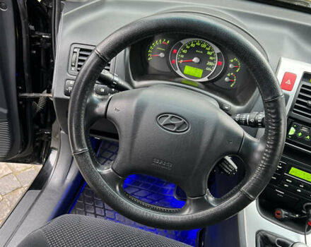 Чорний Хендай Туксон, об'ємом двигуна 1.98 л та пробігом 155 тис. км за 8750 $, фото 10 на Automoto.ua