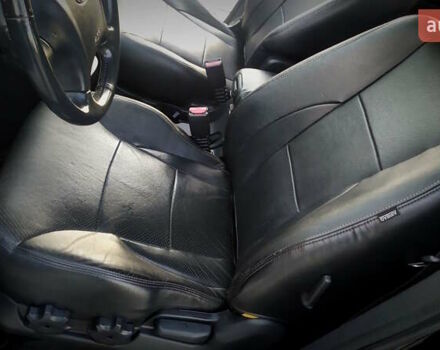 Черный Хендай Туксон, объемом двигателя 2 л и пробегом 230 тыс. км за 8600 $, фото 145 на Automoto.ua