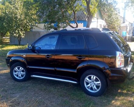 Черный Хендай Туксон, объемом двигателя 2 л и пробегом 236 тыс. км за 8300 $, фото 2 на Automoto.ua