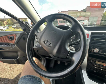 Черный Хендай Туксон, объемом двигателя 2 л и пробегом 198 тыс. км за 8600 $, фото 38 на Automoto.ua