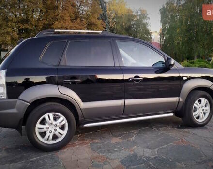 Черный Хендай Туксон, объемом двигателя 2 л и пробегом 230 тыс. км за 8600 $, фото 110 на Automoto.ua