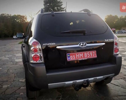 Черный Хендай Туксон, объемом двигателя 2 л и пробегом 230 тыс. км за 8600 $, фото 107 на Automoto.ua