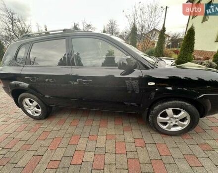 Черный Хендай Туксон, объемом двигателя 2 л и пробегом 218 тыс. км за 7600 $, фото 7 на Automoto.ua